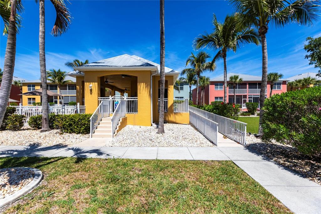 2002 Bal Harbor Boulevard, Unit 1022 Punta Gorda, FL 33950 - Photo 29 of 32 a front view of a house with a yard