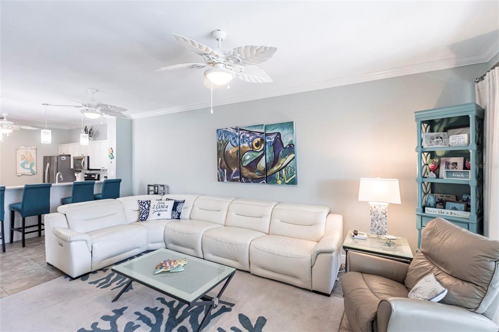 2002 Bal Harbor Boulevard, Unit 1022 Punta Gorda, FL 33950 - Photo 8 of 32 a living room with furniture and a chandelier