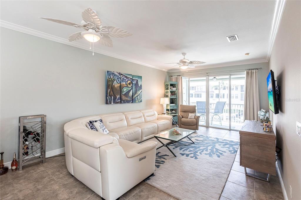 2002 Bal Harbor Boulevard, Unit 1022 Punta Gorda, FL 33950 - Photo 9 of 32 a living room with furniture and large windows