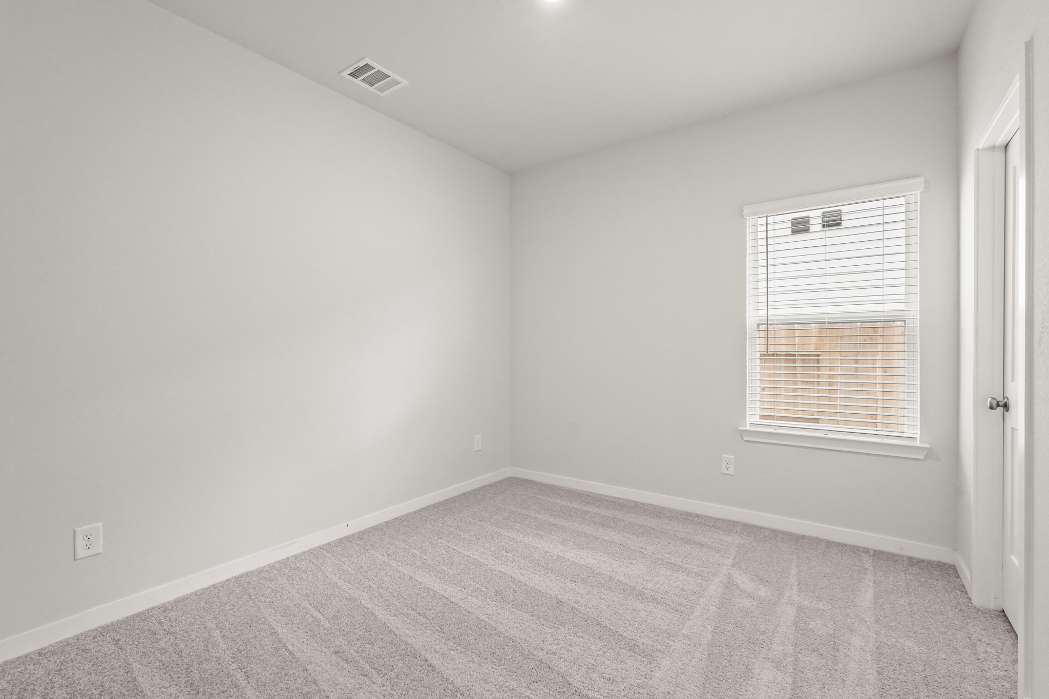 113 Rising Cedar Lane Hockley, TX 77447 - Photo 10 of 27 an empty room with a window