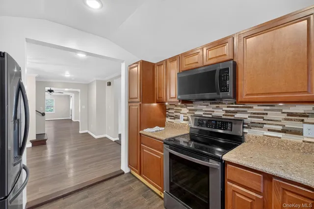 a kitchen with a stove and a microwave