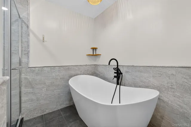 a white bath tub sitting in a bathroom