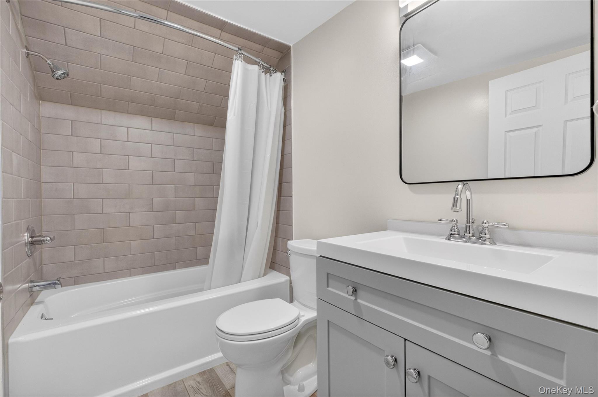 173 North Grand Avenue Poughkeepsie, NY 12603 - Photo 24 of 33 a bathroom with a sink a toilet and bathtub