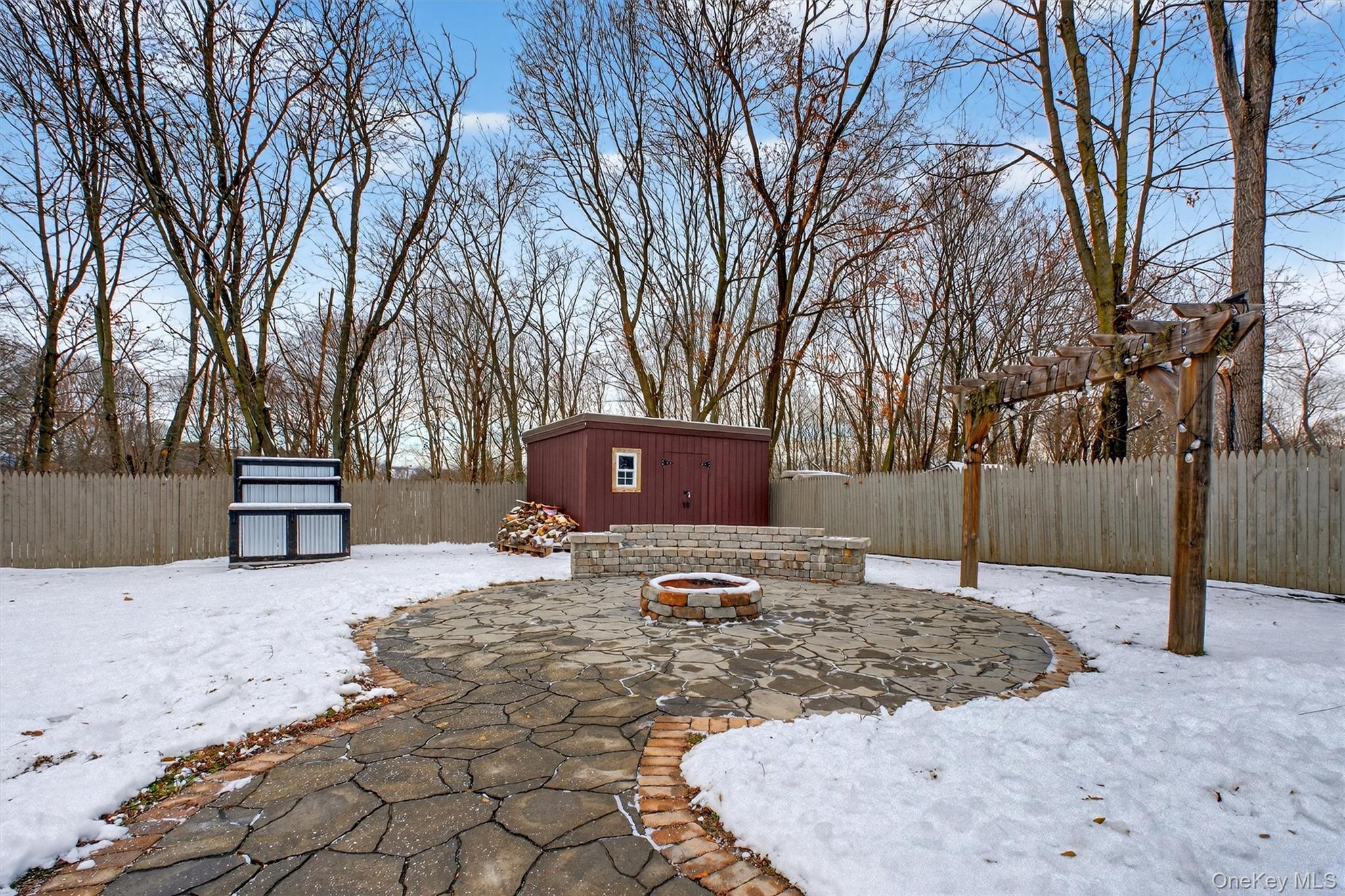 173 North Grand Avenue Poughkeepsie, NY 12603 - Photo 29 of 33 a view of a backyard with snow on the road