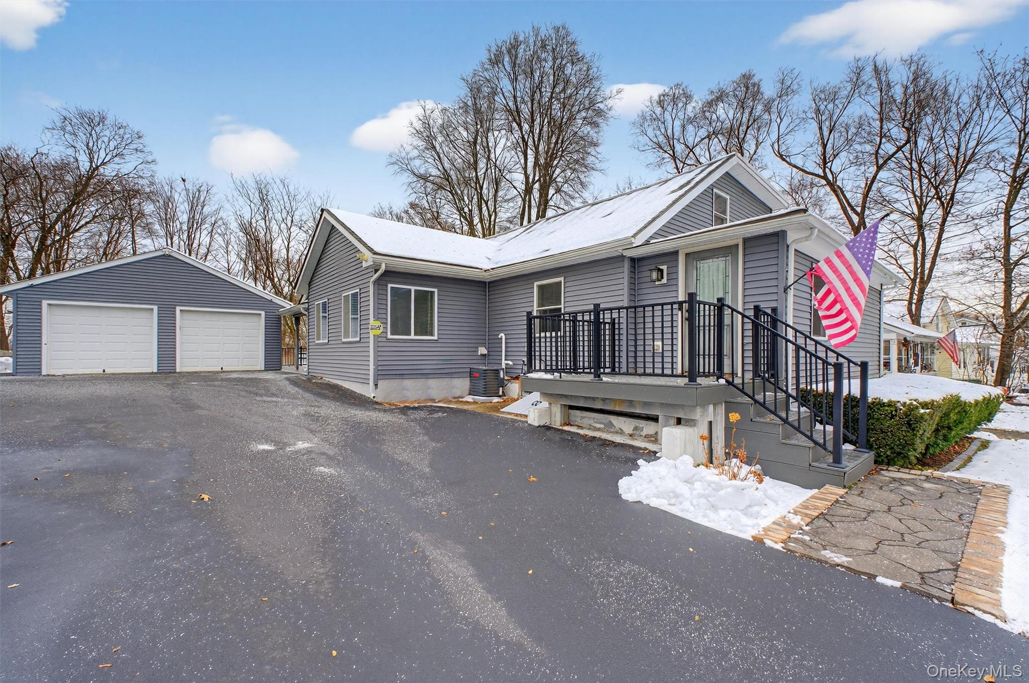 173 North Grand Avenue Poughkeepsie, NY 12603 - Photo 3 of 33 a front view of a house with a yard and garage