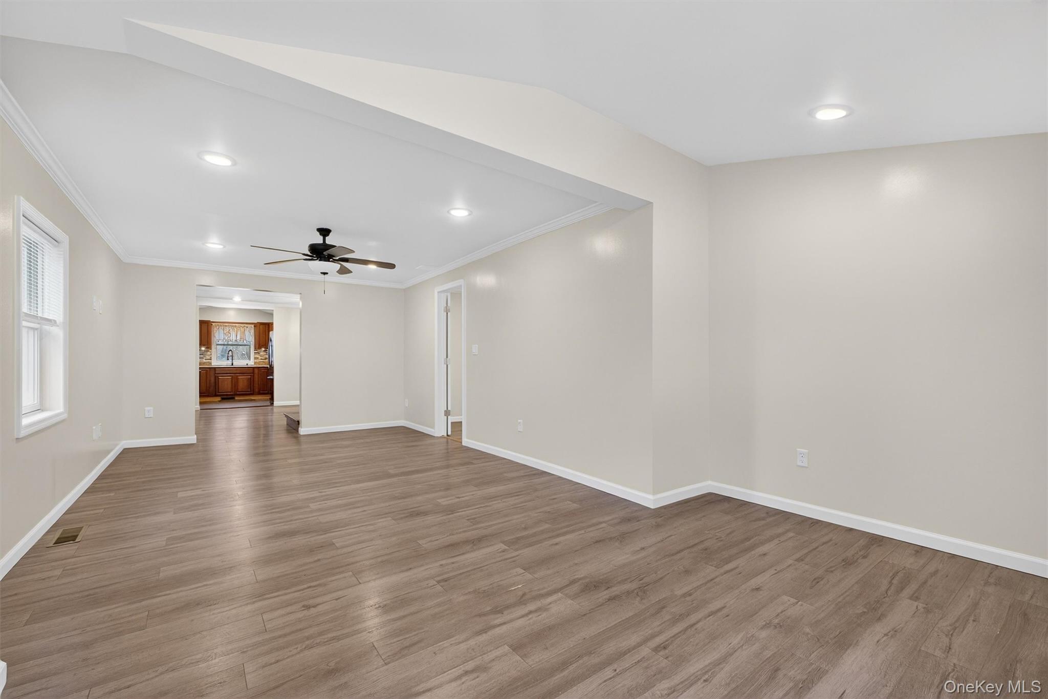173 North Grand Avenue Poughkeepsie, NY 12603 - Photo 5 of 33 a view of an empty room with wooden floor and a window