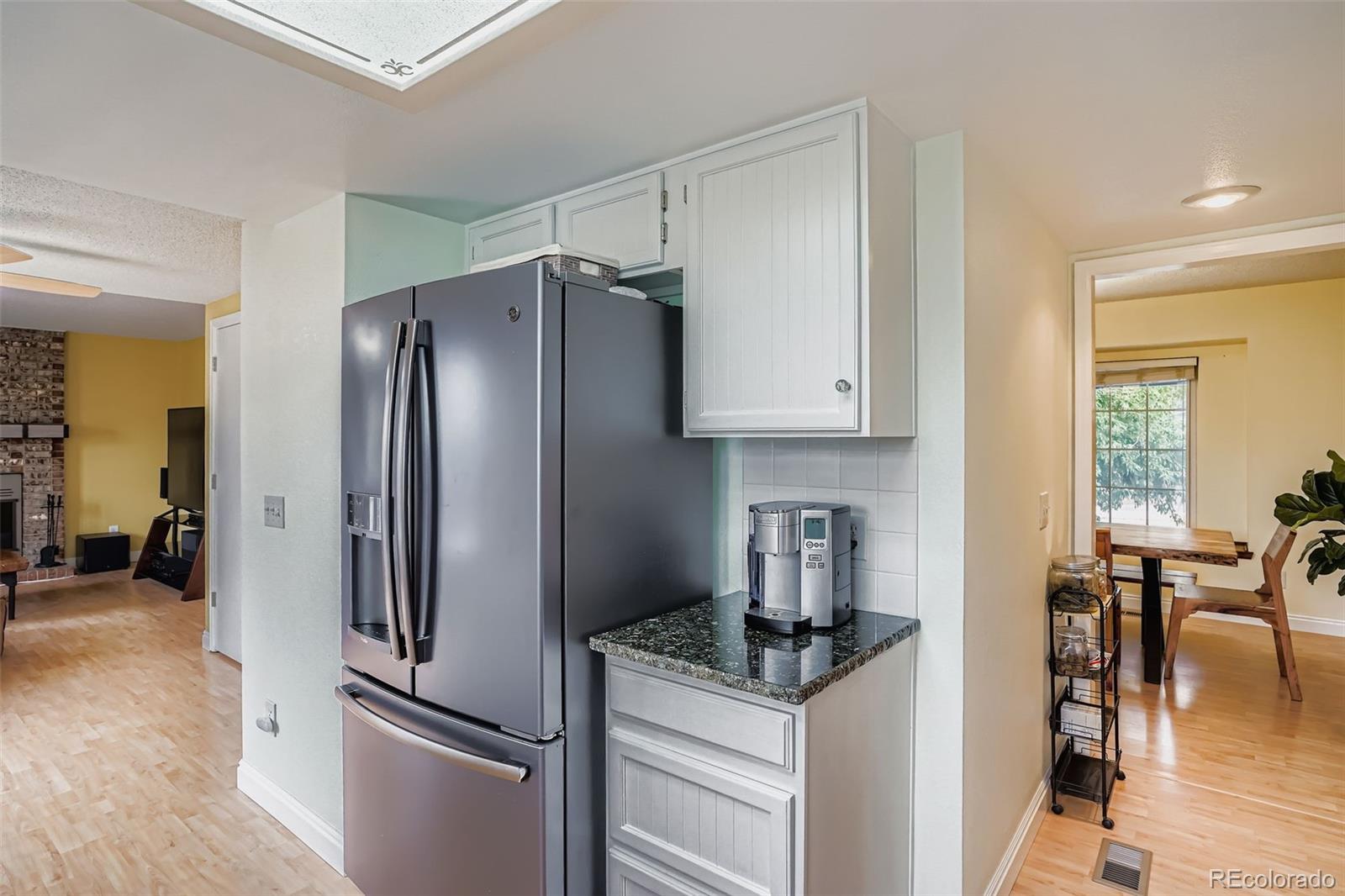 202 Northridge Road Highlands Ranch, CO 80126 - Photo 18 of 37 a kitchen with stainless steel appliances granite countertop a refrigerator and a stove