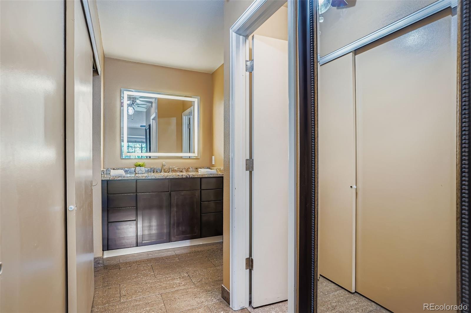 202 Northridge Road Highlands Ranch, CO 80126 - Photo 24 of 37 a bathroom with a sink and a mirror