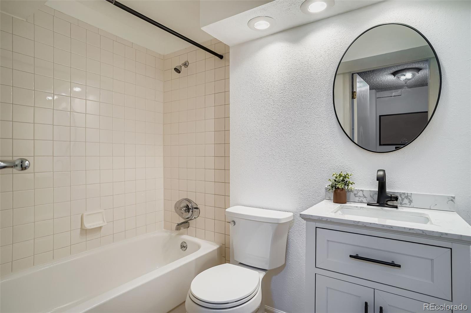 202 Northridge Road Highlands Ranch, CO 80126 - Photo 29 of 37 a bathroom with a toilet a sink and bathtub