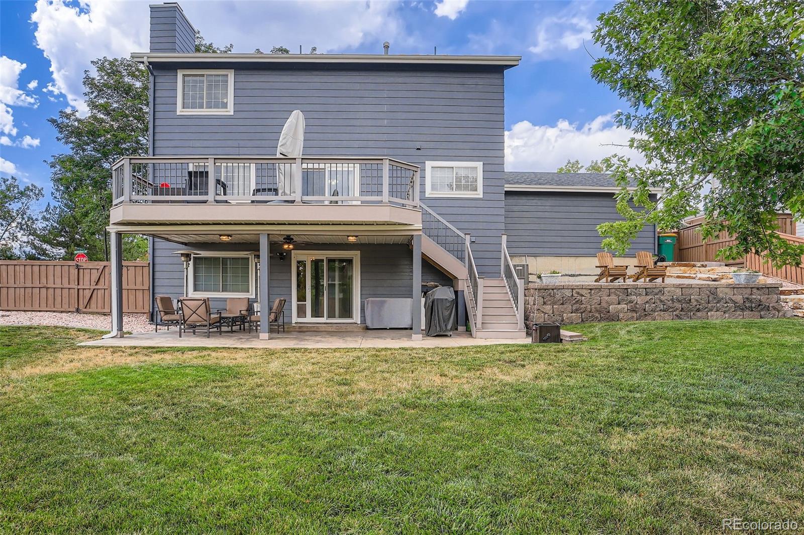 202 Northridge Road Highlands Ranch, CO 80126 - Photo 36 of 37 a view of a house with a yard and sitting area