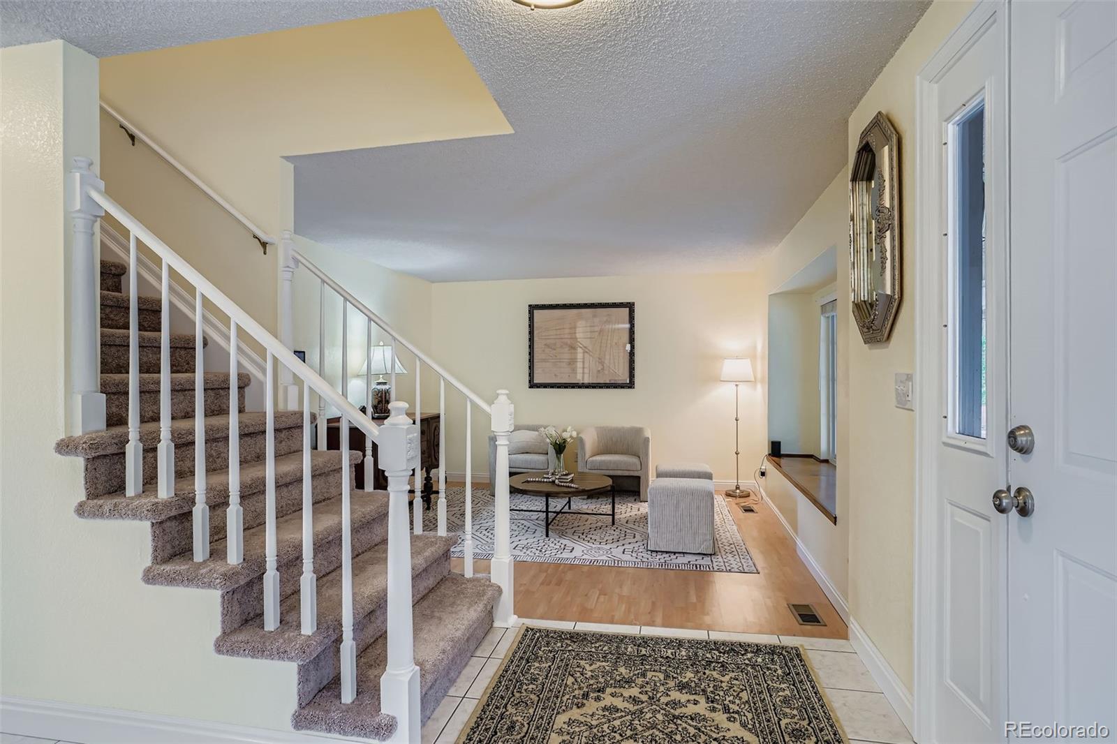 202 Northridge Road Highlands Ranch, CO 80126 - Photo 4 of 37 a view of entryway and hall with wooden floor