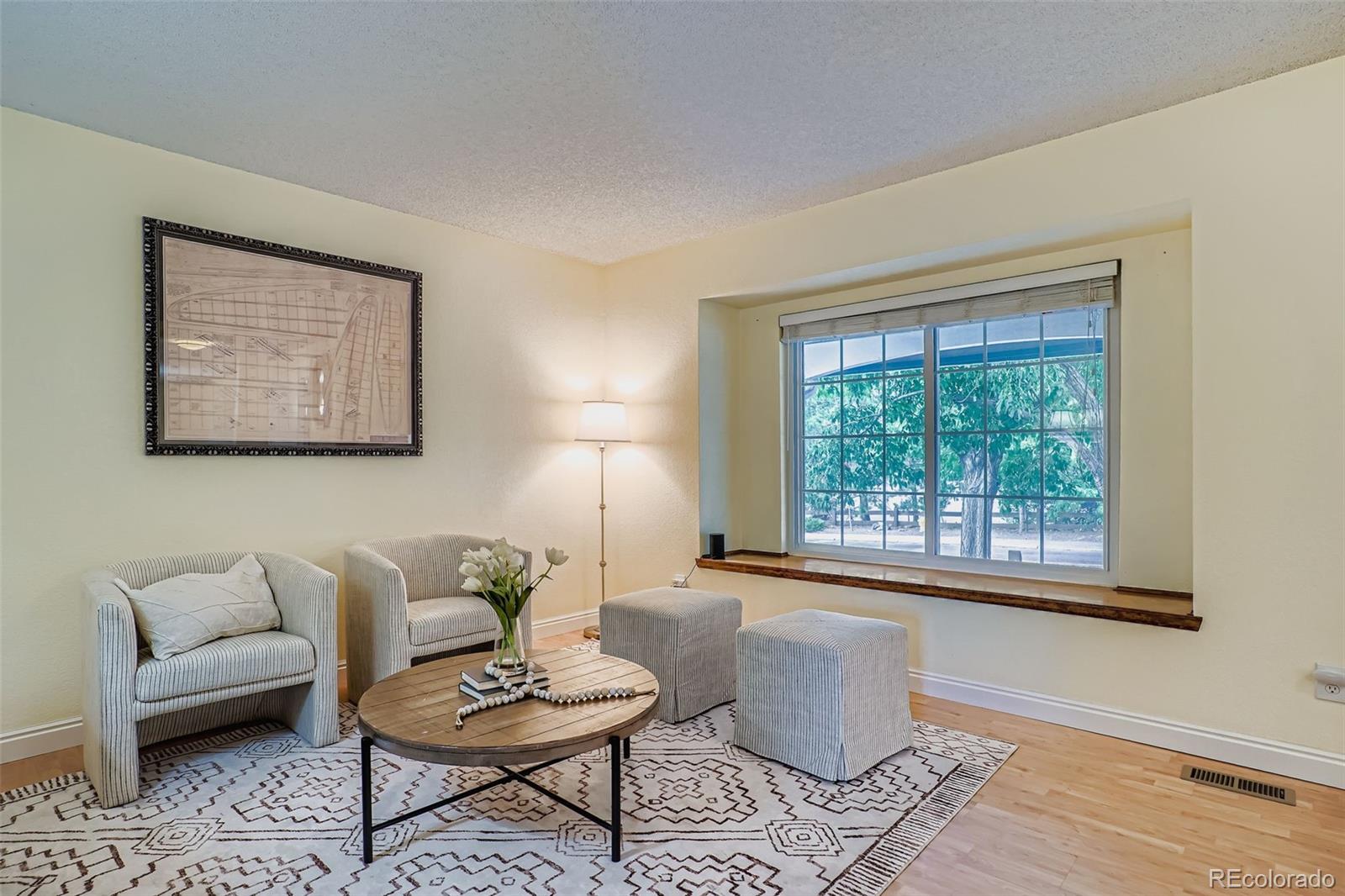 202 Northridge Road Highlands Ranch, CO 80126 - Photo 6 of 37 a living room with furniture and a window