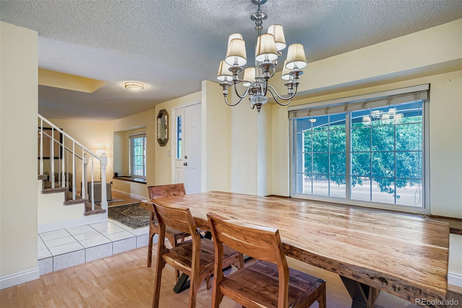 202 Northridge Road Highlands Ranch, CO 80126 - Photo 10 of 37 a view of a dining room with furniture window and wooden floor