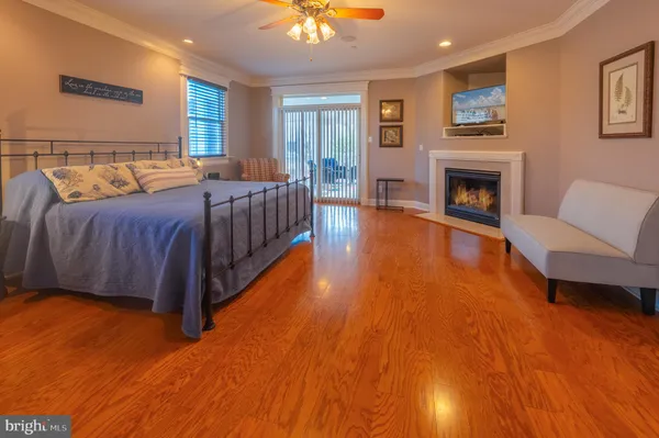 a spacious bedroom with a bed and a chandelier