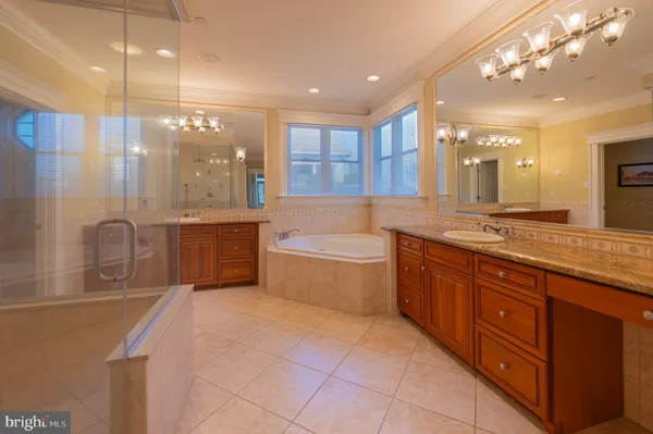 a bathroom with a double vanity sink and a bathtub