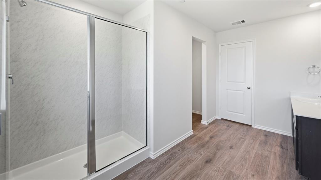 a view of entryway with wooden floor