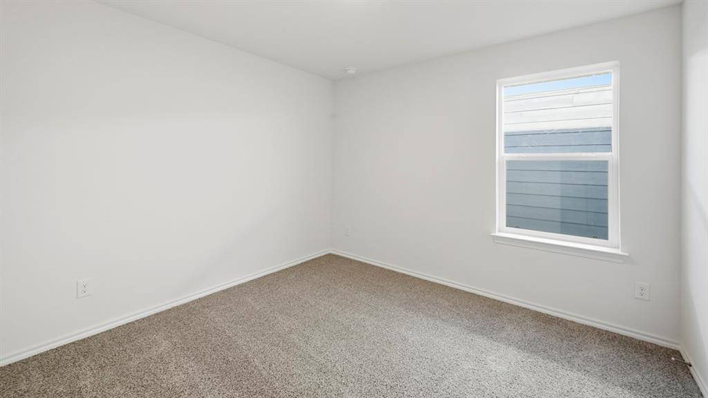 206 Redwood Road Princeton, TX 75407 - Photo 12 of 40 an empty room with a window