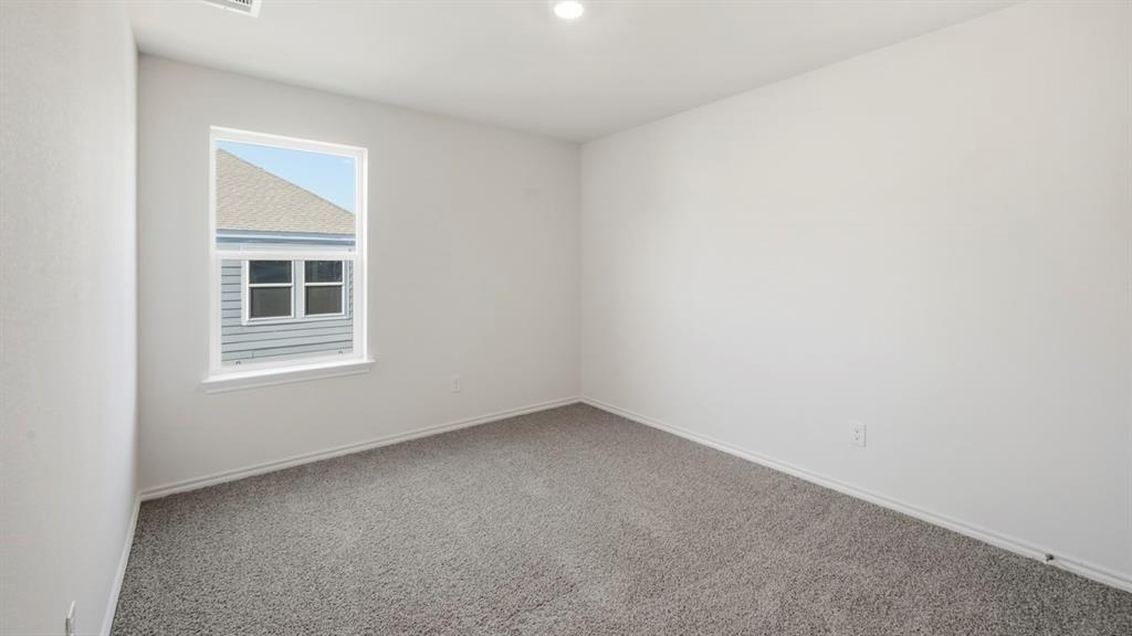 206 Redwood Road Princeton, TX 75407 - Photo 16 of 40 an empty room with a window