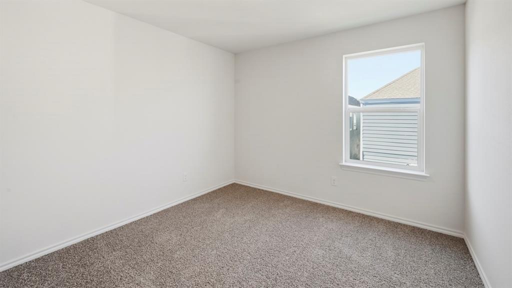 206 Redwood Road Princeton, TX 75407 - Photo 19 of 40 an empty room with a window