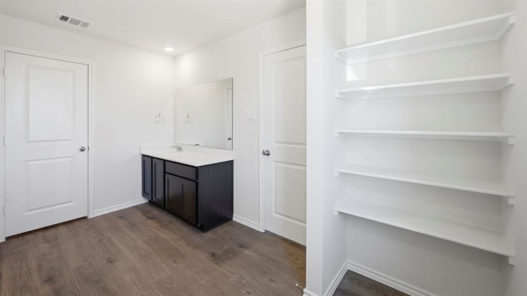 206 Redwood Road Princeton, TX 75407 - Photo 2 of 40 a room with a cabinets and a window