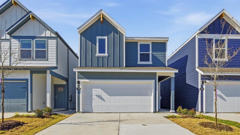 206 Redwood Road Princeton, TX 75407 - Photo 24 of 40 a front view of a house with garden