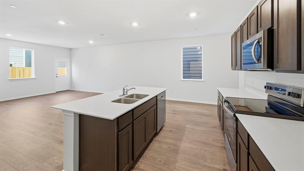 206 Redwood Road Princeton, TX 75407 - Photo 30 of 40 a kitchen with a stove and a kitchen