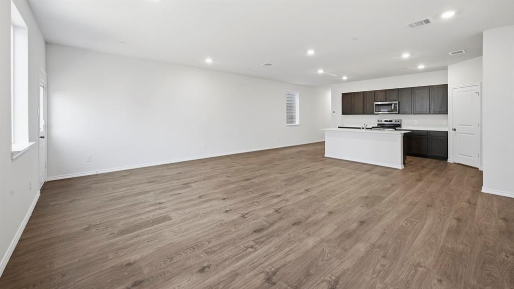 206 Redwood Road Princeton, TX 75407 - Photo 38 of 40 a view of kitchen with kitchen island sink and center island