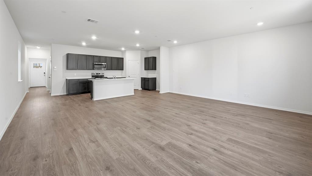 206 Redwood Road Princeton, TX 75407 - Photo 39 of 40 a view of kitchen with wooden floor and electronic appliances