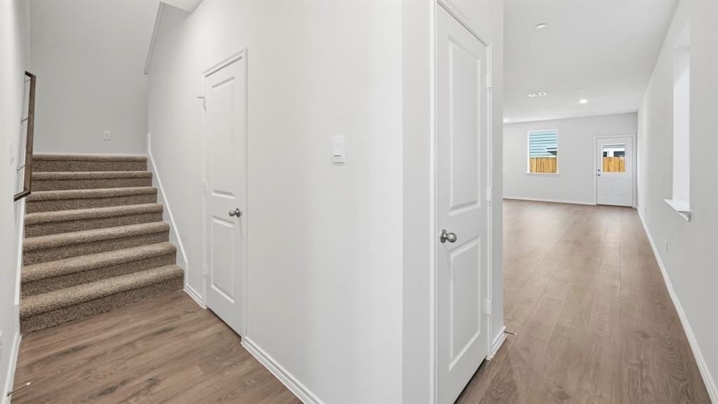 206 Redwood Road Princeton, TX 75407 - Photo 40 of 40 a view of a hallway with wooden floor and entryway