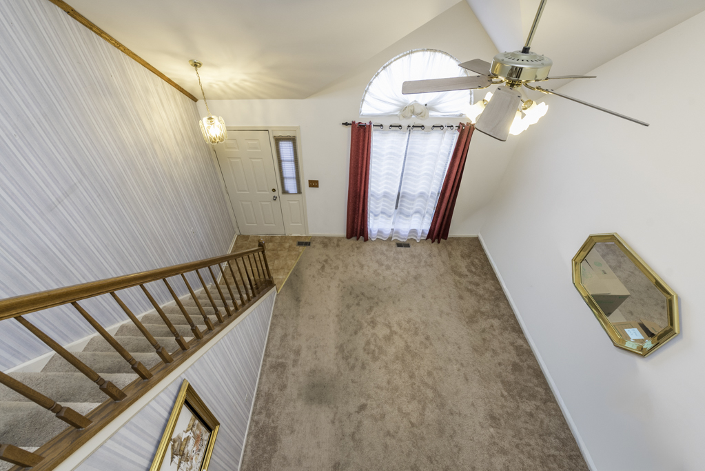 1834 Arbor Court Gurnee, IL 60031 - Photo 11 of 31 a view of a livingroom with furniture and staircase