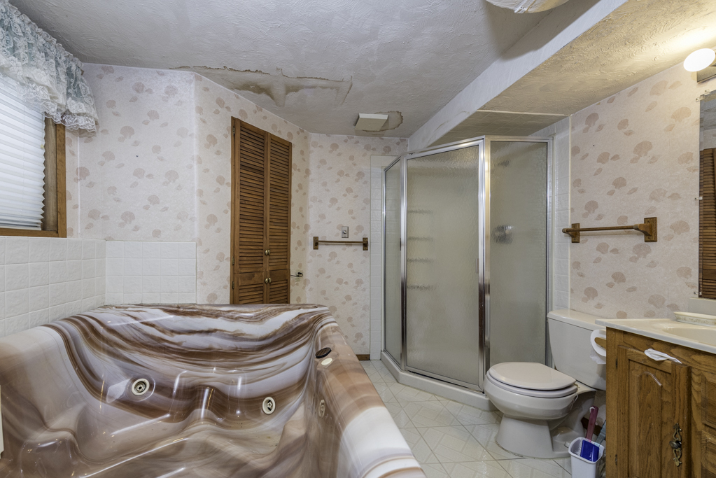 1834 Arbor Court Gurnee, IL 60031 - Photo 25 of 31 a bathroom with a granite countertop toilet sink and shower
