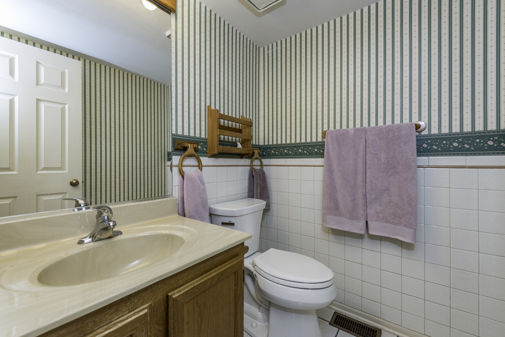 1834 Arbor Court Gurnee, IL 60031 - Photo 26 of 31 a bathroom with a sink a toilet and mirror