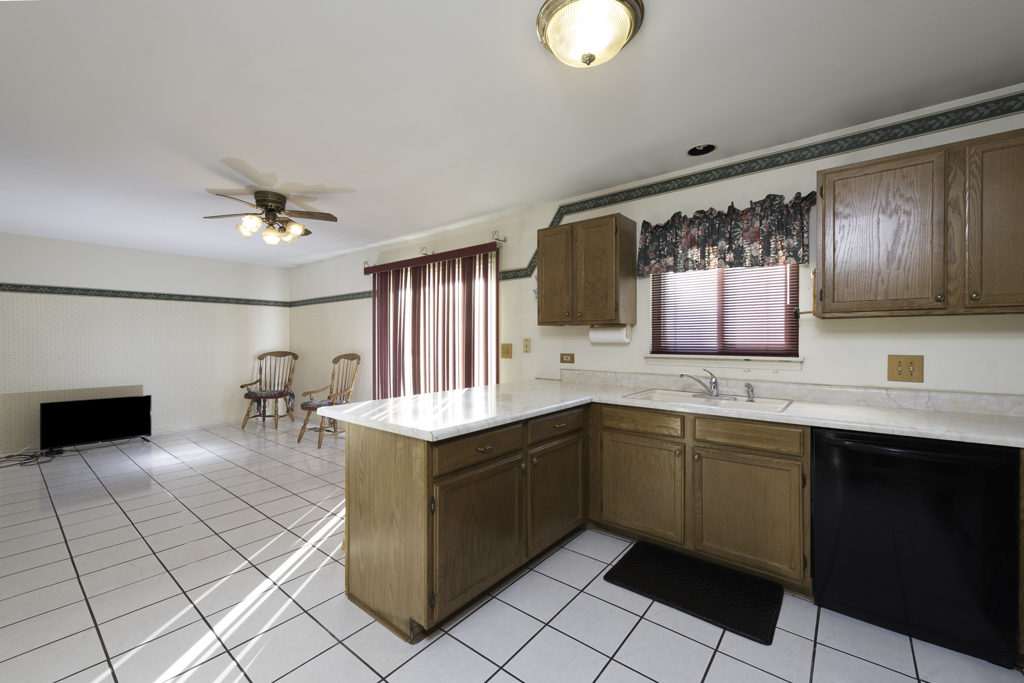1834 Arbor Court Gurnee, IL 60031 - Photo 4 of 31 a kitchen with a sink cabinets and appliances