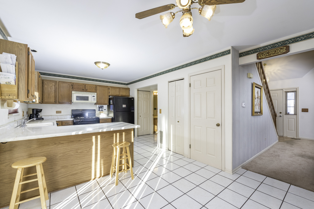 1834 Arbor Court Gurnee, IL 60031 - Photo 6 of 31 a kitchen with stainless steel appliances granite countertop a refrigerator and a sink