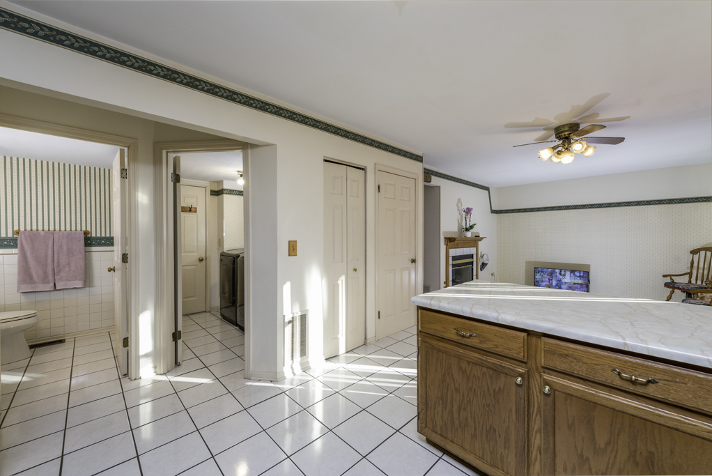 1834 Arbor Court Gurnee, IL 60031 - Photo 8 of 31 a spacious bathroom with a sink a mirror and a shower