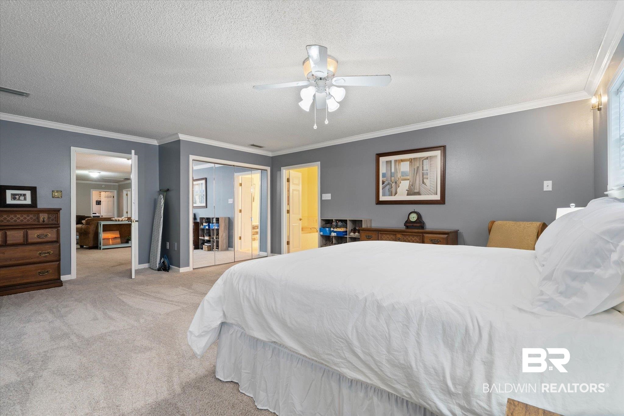 2300 Radcliff Road Saraland, AL 36571 - Photo 24 of 56 Bedroom featuring light colored carpet, ornamental molding, a ceiling fan, and a textured ceiling