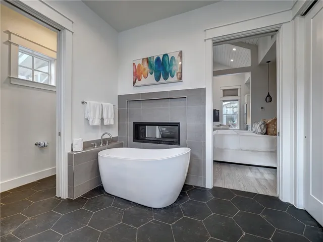 a living room with a couch and a fireplace