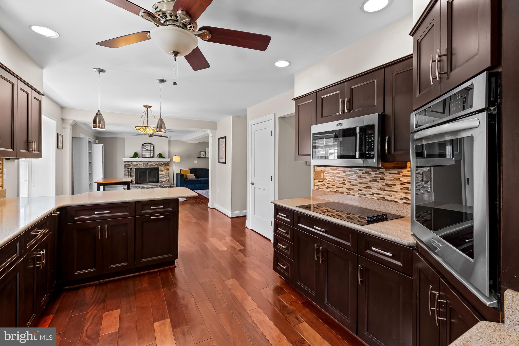 14305 Robcaste Road Phoenix, MD 21131 - Photo 17 of 53 a kitchen with stainless steel appliances granite countertop a stove and a sink