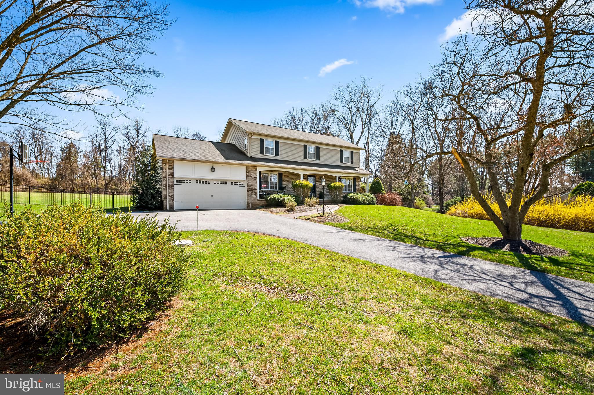 14305 Robcaste Road Phoenix, MD 21131 - Photo 2 of 53 a front view of a house with a yard