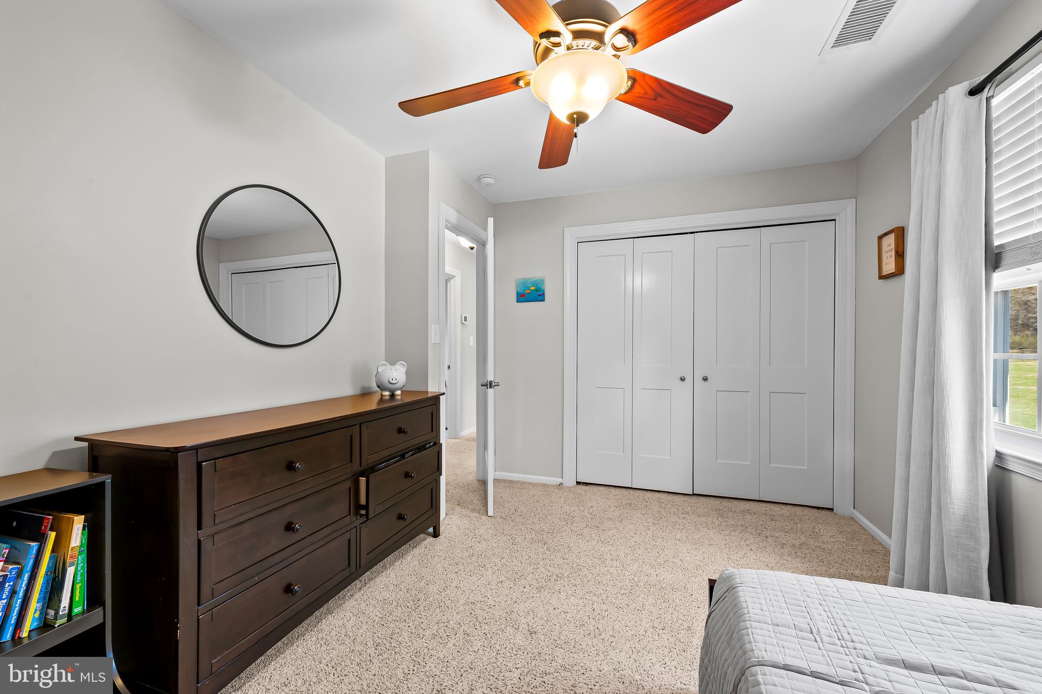 14305 Robcaste Road Phoenix, MD 21131 - Photo 33 of 53 a bedroom with a bed and a chandelier