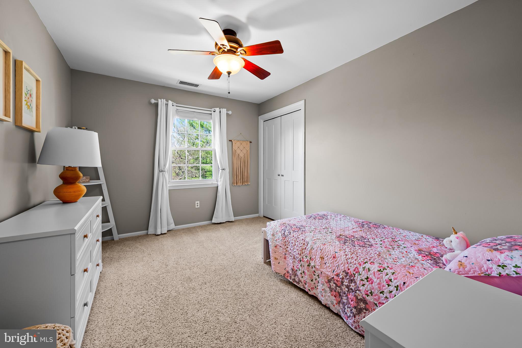 14305 Robcaste Road Phoenix, MD 21131 - Photo 36 of 53 a bedroom with a bed and a chandelier
