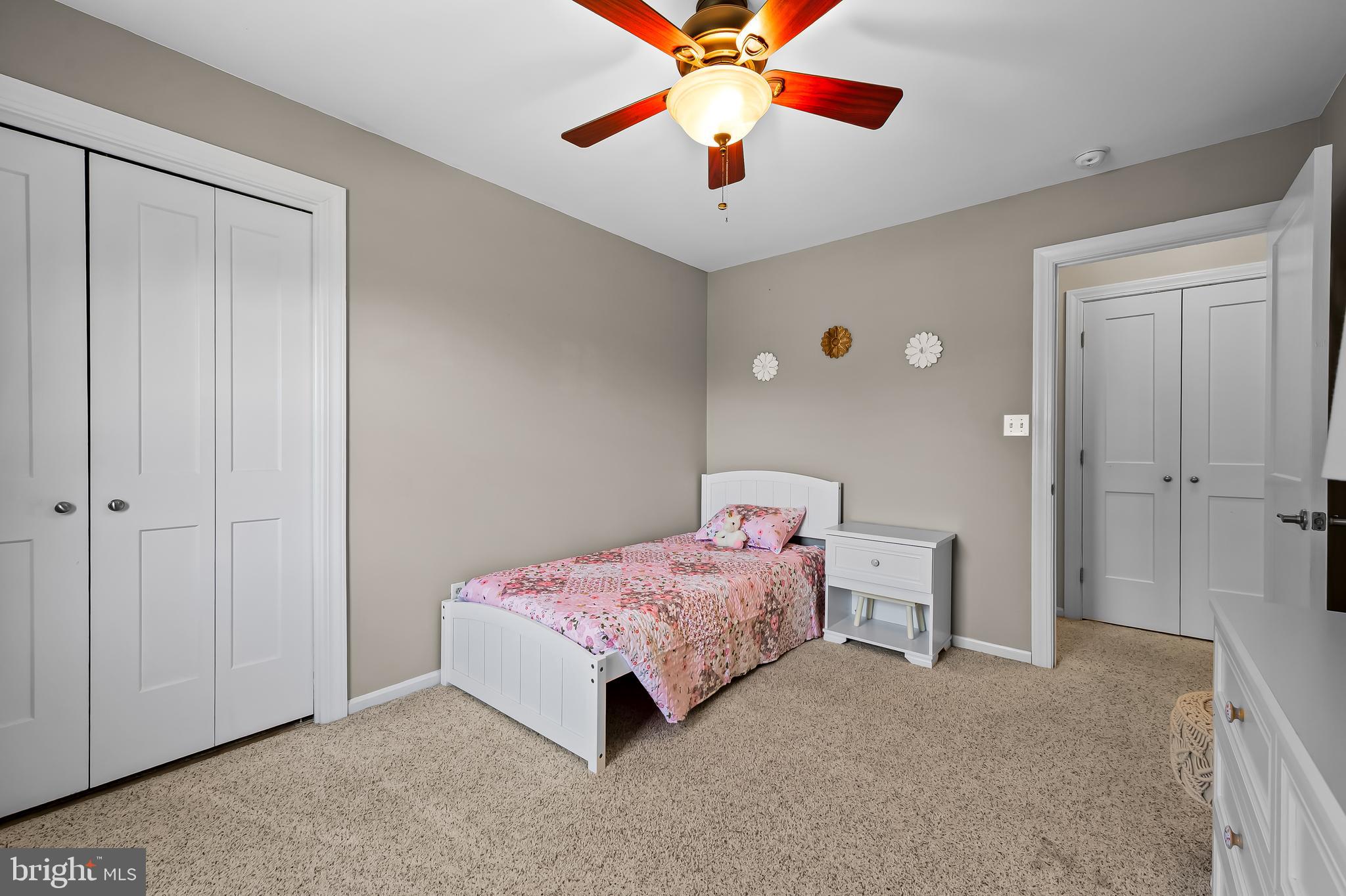 14305 Robcaste Road Phoenix, MD 21131 - Photo 37 of 53 a bedroom with a bed and a chandelier