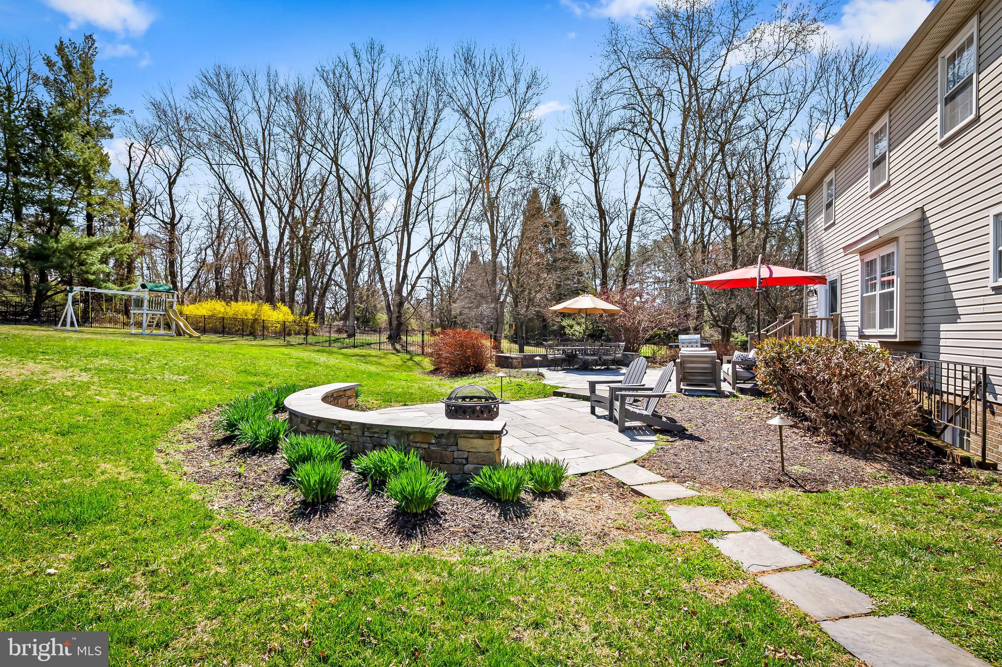 14305 Robcaste Road Phoenix, MD 21131 - Photo 41 of 53 a front view of a building with garden and trees