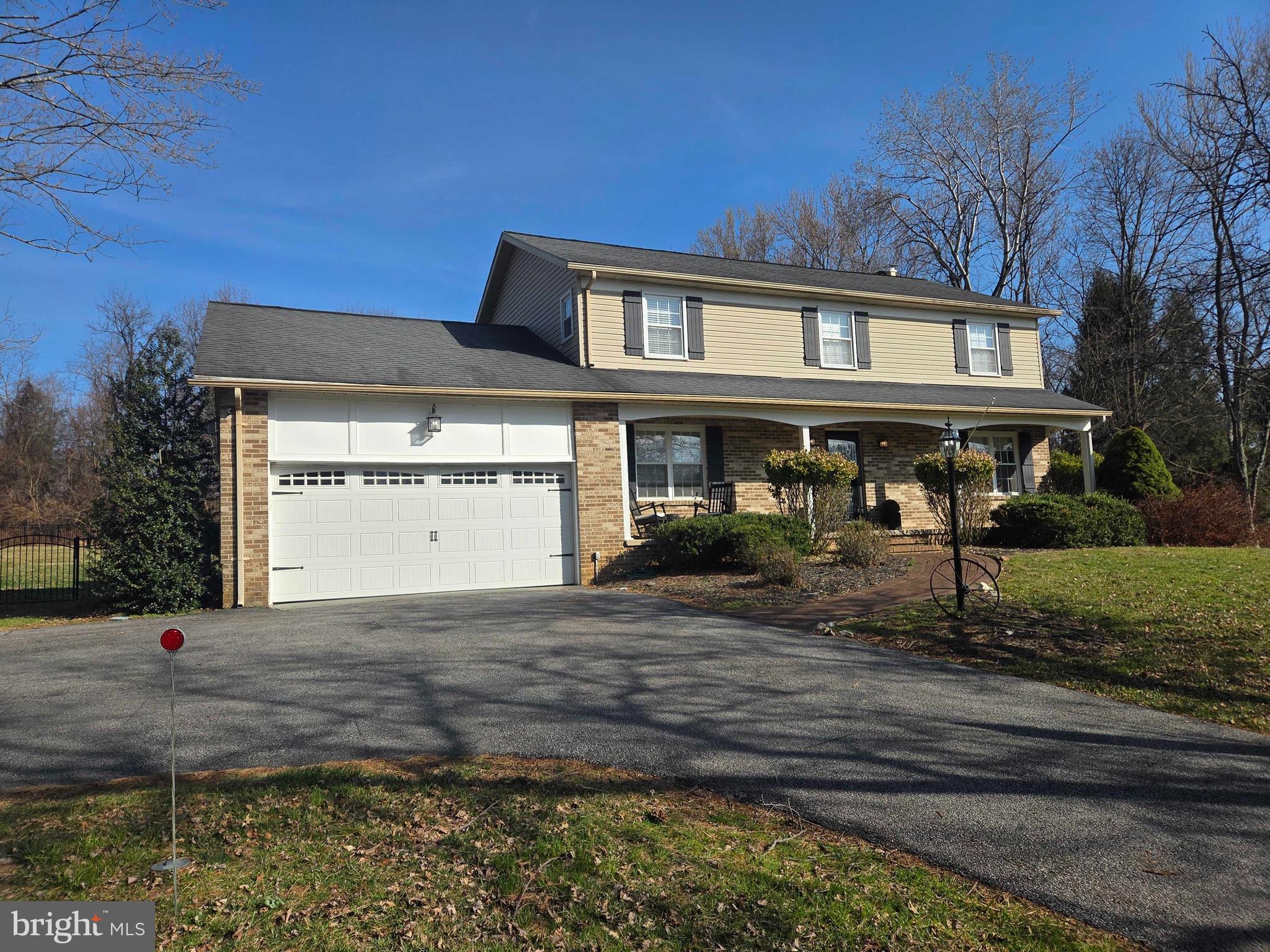 14305 Robcaste Road Phoenix, MD 21131 - Photo 47 of 53 a front view of a house with garden