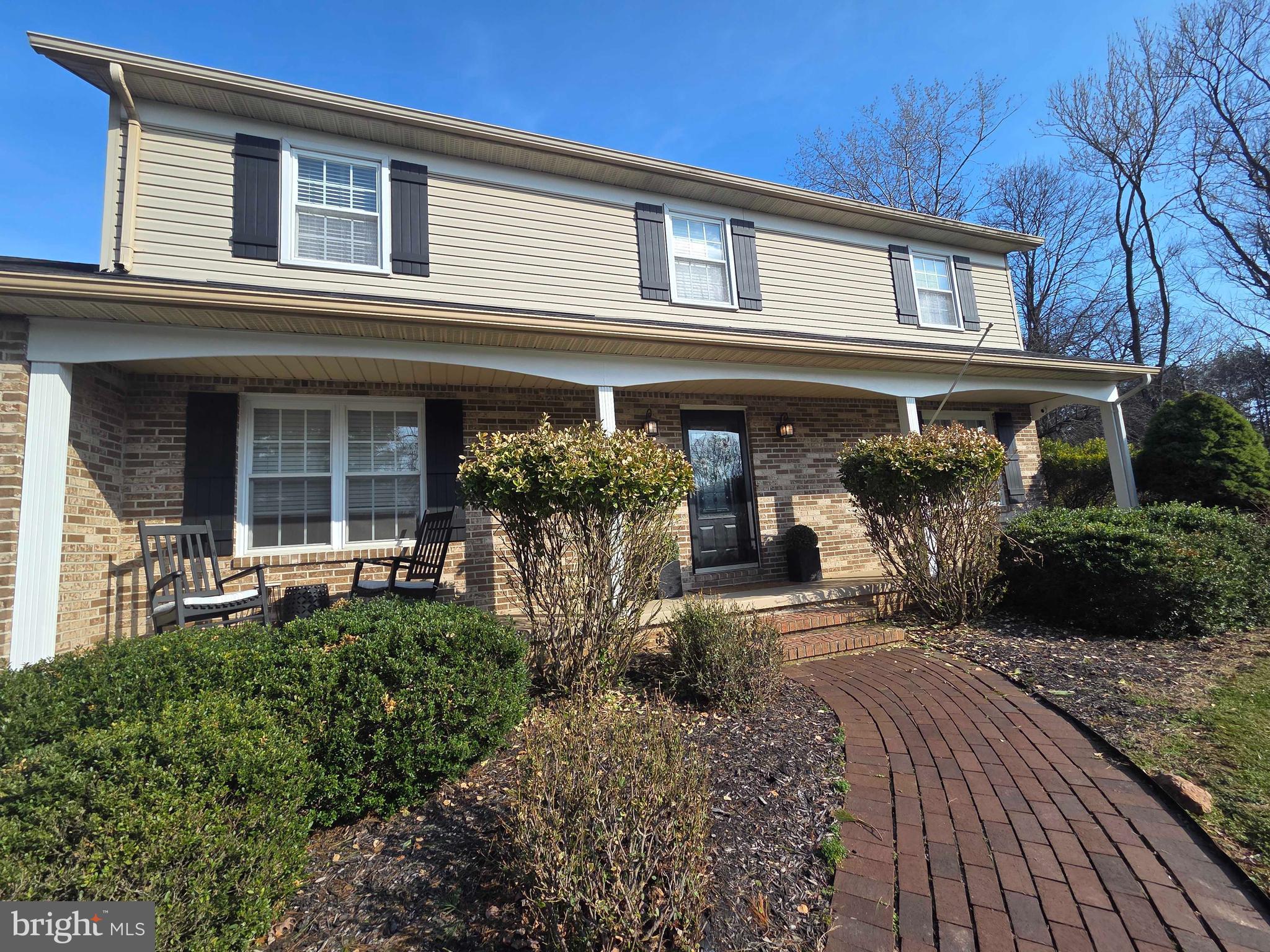 14305 Robcaste Road Phoenix, MD 21131 - Photo 48 of 53 a front view of a house with garden