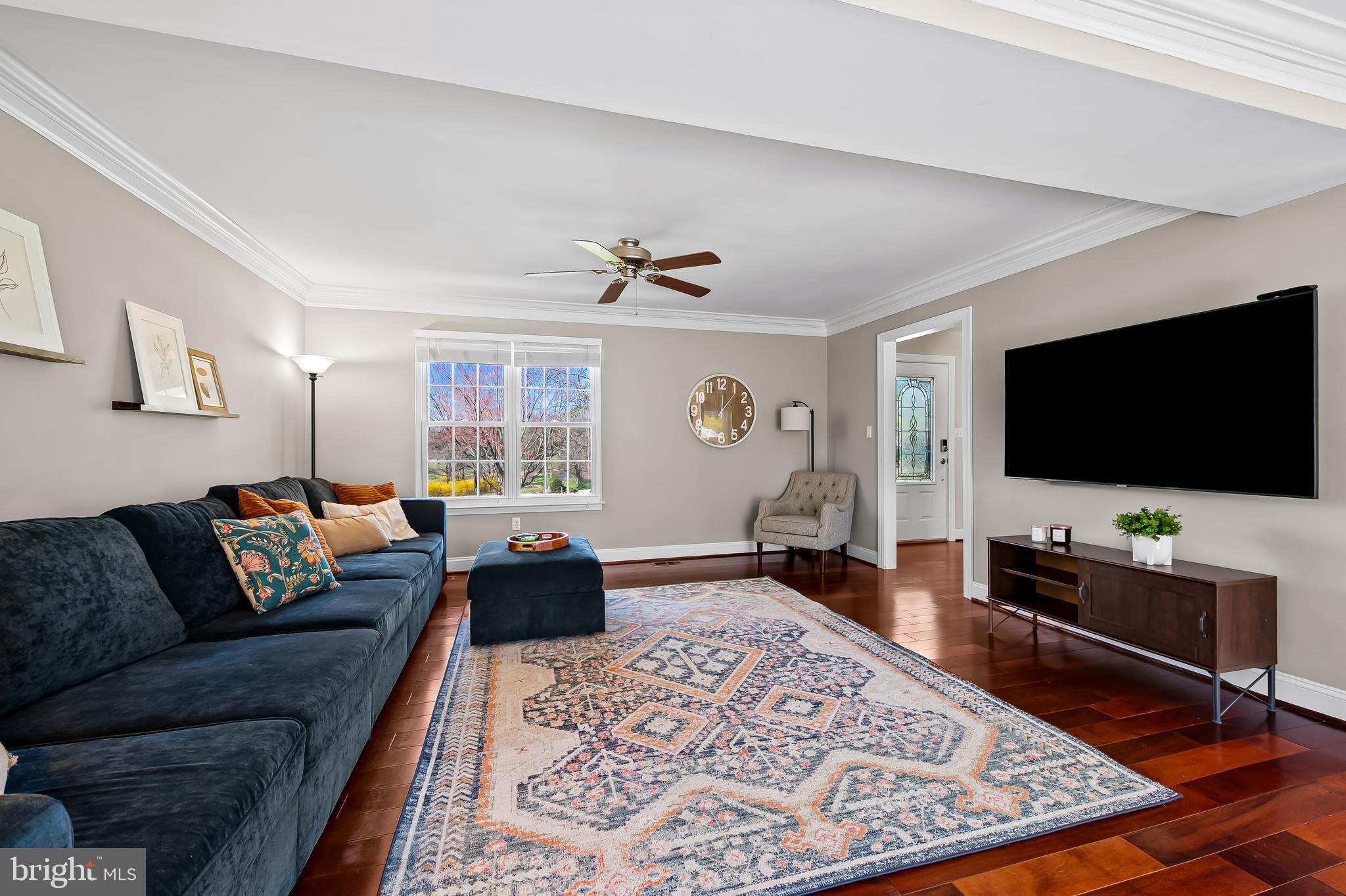 14305 Robcaste Road Phoenix, MD 21131 - Photo 7 of 53 a living room with furniture and a flat screen tv