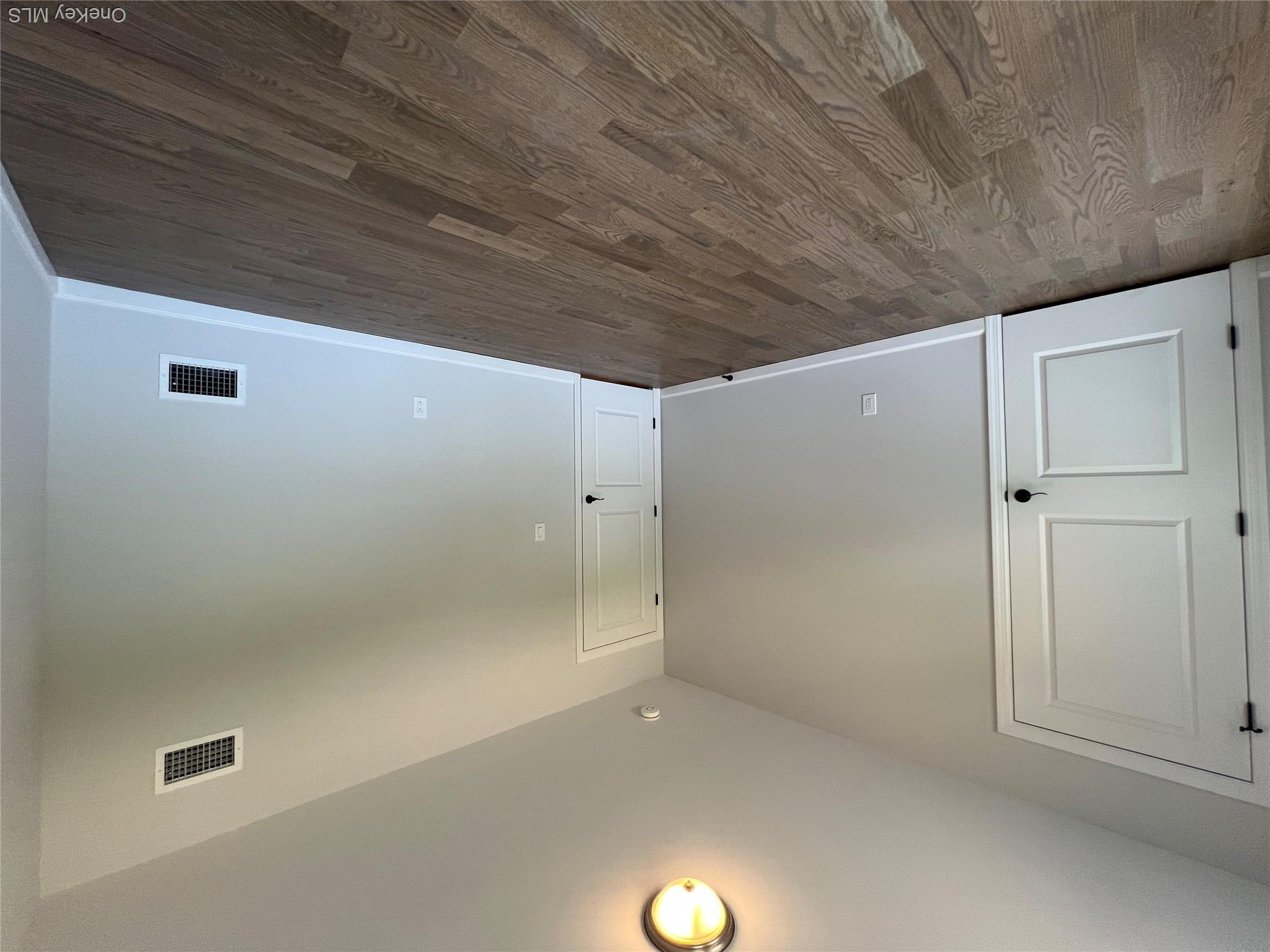 35 Babylon Road Mastic Beach, NY 11951 - Photo 16 of 19 a view of an empty room with wooden floor