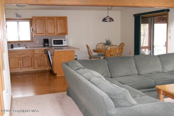 588 Edinburgh Road Bushkill, PA 18324 - Photo 8 of 19 a living room with furniture a window and a kitchen view