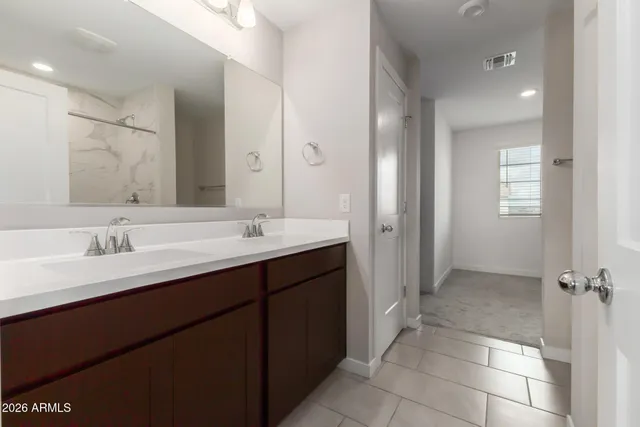 a bedroom with a bed and a book shelf