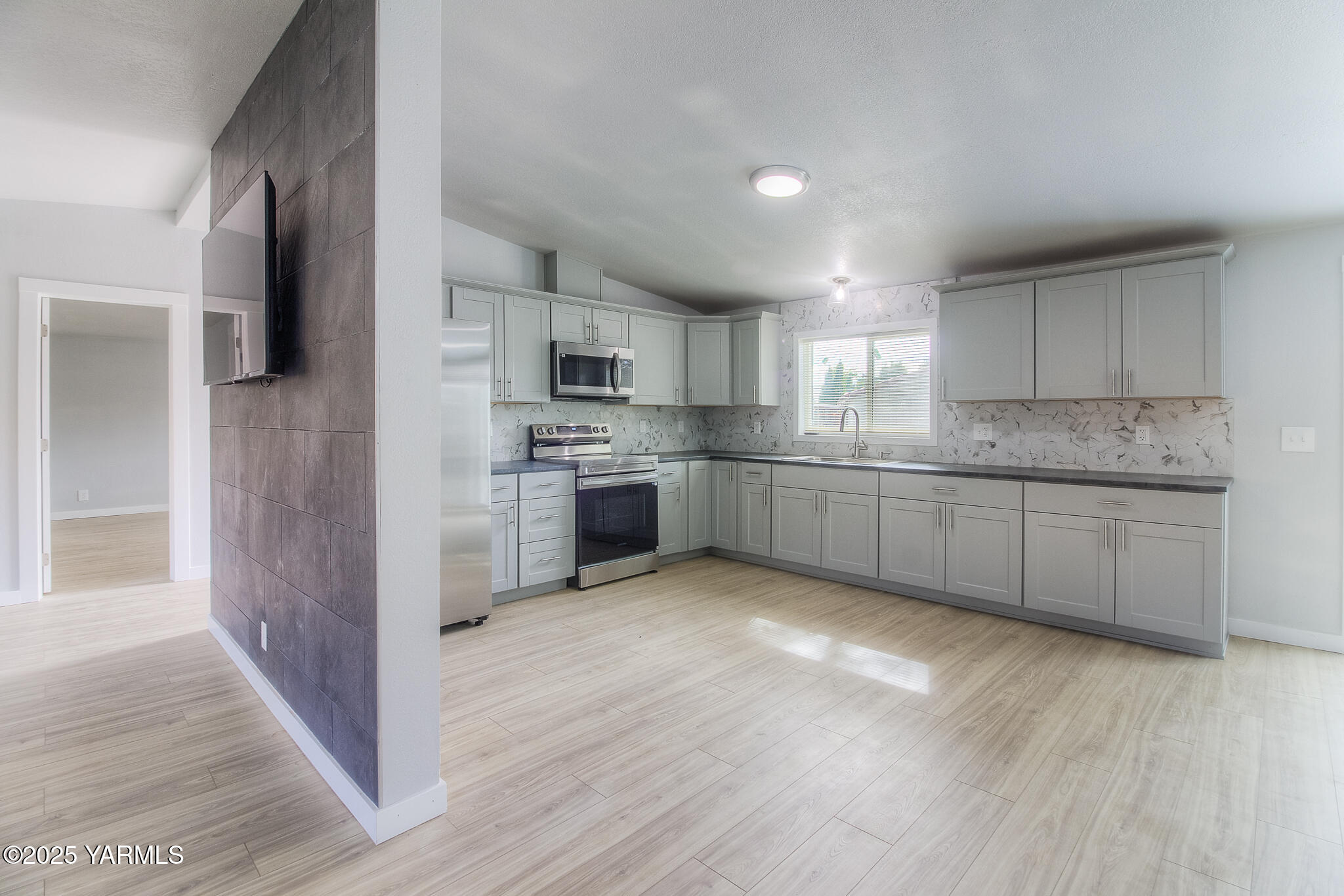 10420 Ahtanum Road Yakima, WA 98903 - Photo 3 of 24 a large kitchen with cabinets and stainless steel appliances